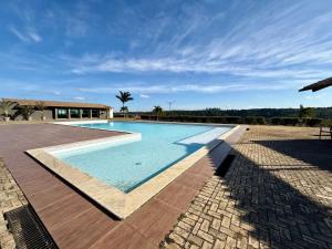 a swimming pool in the middle of a resort at yes banana in Bananeiras
