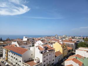 an aerial view of a city with buildings at Minha Alegre Casinha in Sines