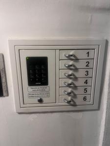 a microwave oven on the side of a wall at Urban City Nest in Vienna