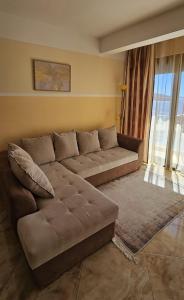 a living room with a large couch in a room at Apartment Sea Space 2 in Dobra Voda +36 photos
