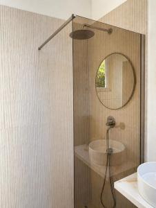 a bathroom with a shower with a sink and a mirror at NAIA apartment in Koper +7 photos