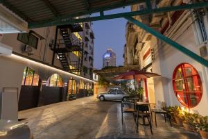 a car parked in the middle of a street at Hotel Rue De Siam in Chinatown