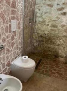 a bathroom with a toilet and a sink at Stradone centrale in Vieste