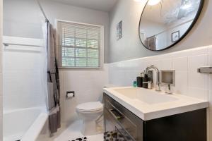 a bathroom with a sink and a toilet and a mirror at Nostalgic In Norwood in Birmingham +24 photos