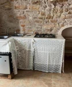 a kitchen with a table with a table cloth on it at Stradone centrale in Vieste