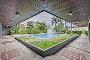 an exterior view of a swimming pool in a house at Hotel Caña Brava Inn in Cañas
