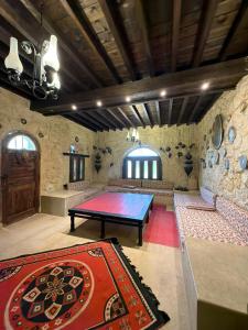 a ping pong table in the middle of a room at Tunis Village,lake view countryside villas in Tunis