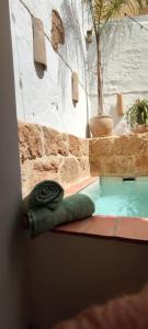 a small swimming pool in a building with at Ca La Portella in Jávea