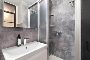 a bathroom with a sink and a shower at Forest Elegance in Freudenstadt +29 photos