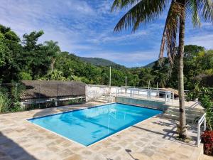 a swimming pool with a view of a mountain at Casa Country Niterói in Niterói +28 photos
