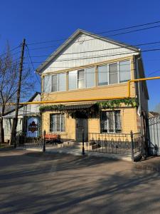 a building with a fence in front of it at Duman House in Almaty