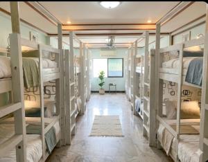 a hallway with bunk beds in a room at European Hostel Central Pattaya in Pattaya