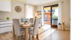 a kitchen and dining room with a table and chairs at This is my happy place in Leggiuno