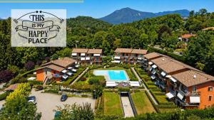 an aerial view of a house with a swimming pool at This is my happy place in Leggiuno