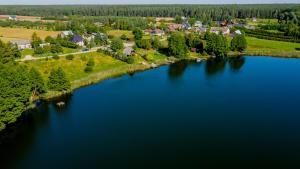 an aerial view of a large body of water at Ostoja Tobołowo in Tobołowo
