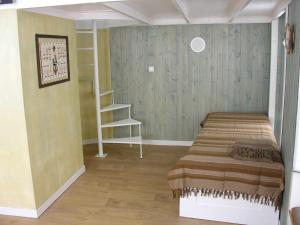 a bedroom with a bed in a room at THE BOAT - Apartamento Temático in Seixal
