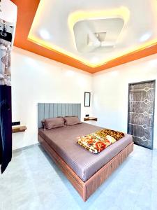 a bedroom with a bed in a room at Shiv Guest house in Ellora
