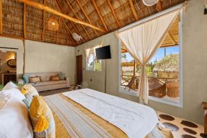 a bedroom with a large bed and a large window at Panchos Paradise in Puerto Vallarta +66 photos