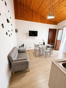 a living room with a couch and a table at Mediterranea Apartment in Agrigento