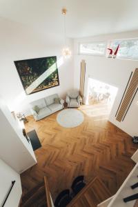 an aerial view of a living room with wood floors at AMRAI Magnetic in Ventspils