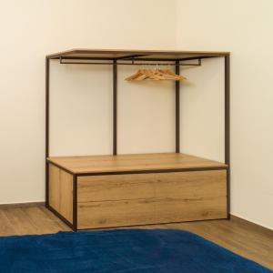 a closet with a wooden cabinet and a blue rug at Prima Classe Battipaglia in Battipaglia +36 photos