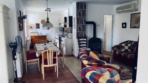a living room with a couch and a table at FLY Vendégház in Szólád