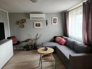 a living room with a couch and a table at Gate 1 apartment in Måløy