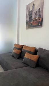 a couch in a room with a picture of a car at Diktamo Coast Living in Ofrínion