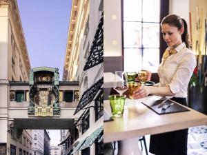 a woman is sitting at a table with a clock at Mercure Vienna First in Vienna