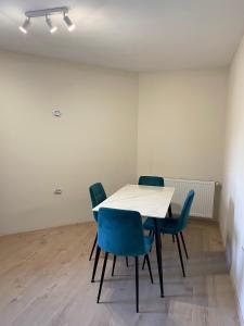 a table and chairs in an empty room at Vivat in Berehove +6 photos