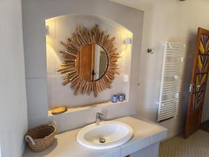 a bathroom with a sink and a mirror at Clair de Provence in Entrevennes +21 photos