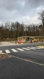 an empty intersection of a street with a building at Bagnole de l'Orne Studio in Bagnoles de l'Orne