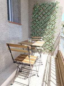 a table and a bench sitting on a patio at Pensión Restaurante Páramo in La Herradura