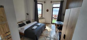 a bedroom with a bed with two towels on it at O.W. LAZUR nad jeziorem in Żywiec