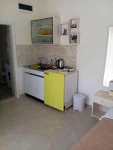 a kitchen with a sink and a counter top at Apartment Deki studio 2 in Kotor