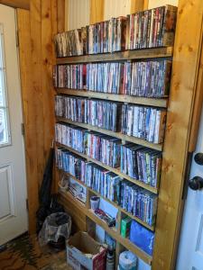 a wall full of dvds at Colorado Cottages in Estes Park
