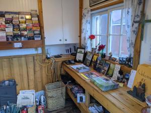 a room with a wooden counter with books on it at Colorado Cottages in Estes Park