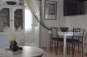 a dining room with a table and chairs at Castle View in Samothraki +8 photos