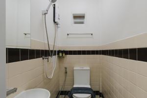 a bathroom with a toilet and a sink at Kavana Kata Residence in Phuket +13 photos
