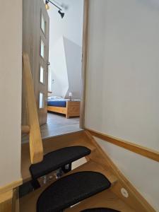 a room with two chairs and a mirror at Domek na Górce 2 in Krościenko