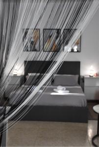 a bedroom with a bed with a mosquito net at Castle View in Samothraki