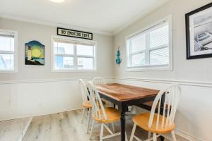 a dining room with a wooden table and chairs at Beachfront - Private Walkover to Beach in Surfside Beach