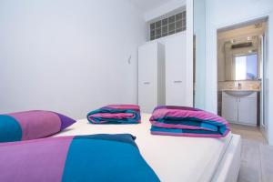 Postel nebo postele na pokoji v ubytování Apartments Aida