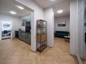 a room with a kitchen and a living room at M6 Rooms Riga in Riga