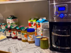 a refrigerator shelf with a bunch of food ingredients at Chelsea Rooms NYC in New York +10 photos