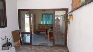 a sliding glass door leading to a living room at Sobrado entrada de Paraty in Paraty