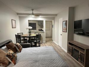 a living room with a table and a dining room at Surfer's Bungalow in San Diego