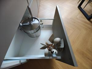 a glass shelf with a pot and a plant on it at Base Camp - Apartmán Klínovec in Kovářská