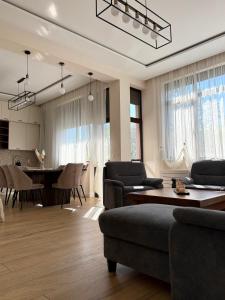 a living room with a couch and a table at Easy Stay in Karlovo