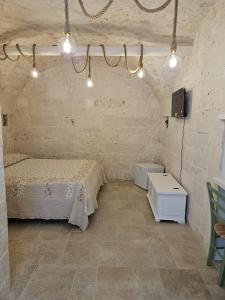 a room with two beds and a tv in it at Stanza29 in Martina Franca